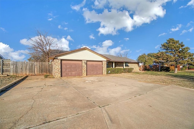 view of front of house featuring a garage and a front lawn