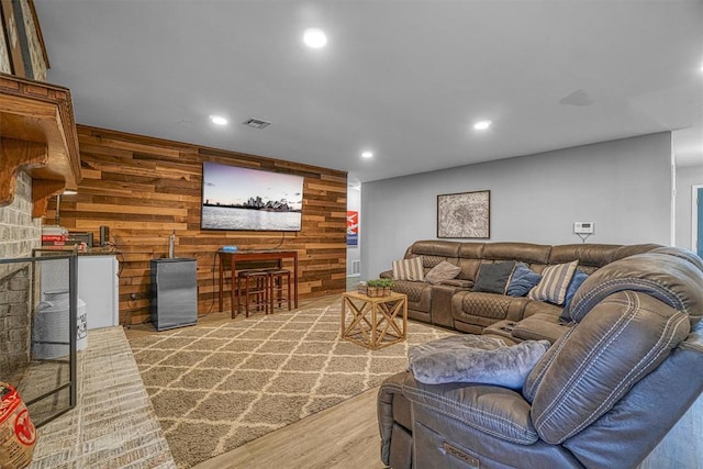 living room featuring wood walls