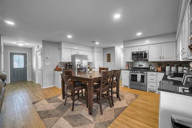 dining room with light hardwood / wood-style flooring