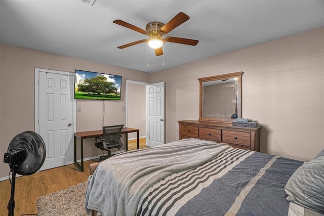 bedroom featuring ceiling fan and light hardwood / wood-style flooring