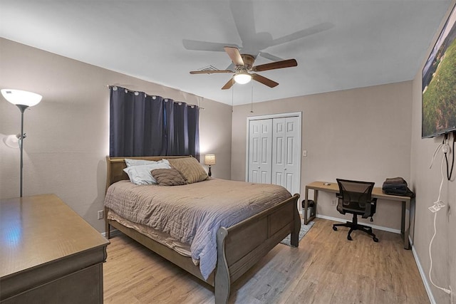 bedroom featuring a closet, ceiling fan, and light hardwood / wood-style flooring