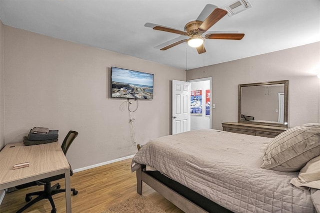 bedroom with ceiling fan and light hardwood / wood-style flooring