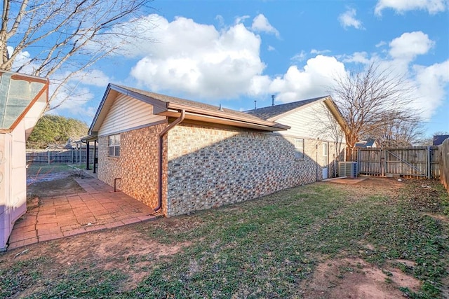 view of side of home featuring a patio