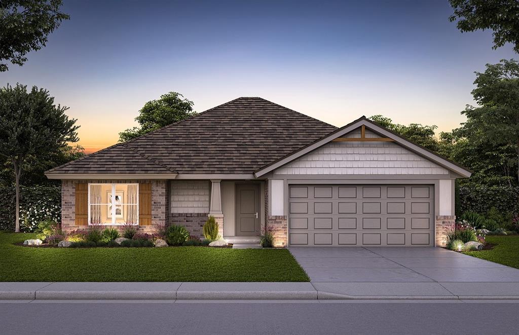 view of front facade featuring a yard and a garage