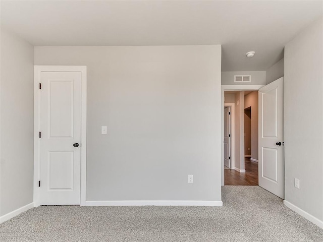 spare room with carpet floors