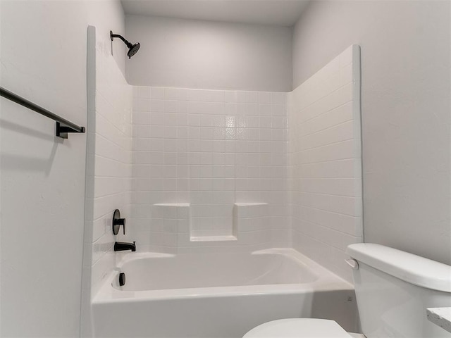 bathroom featuring toilet and shower / bathtub combination