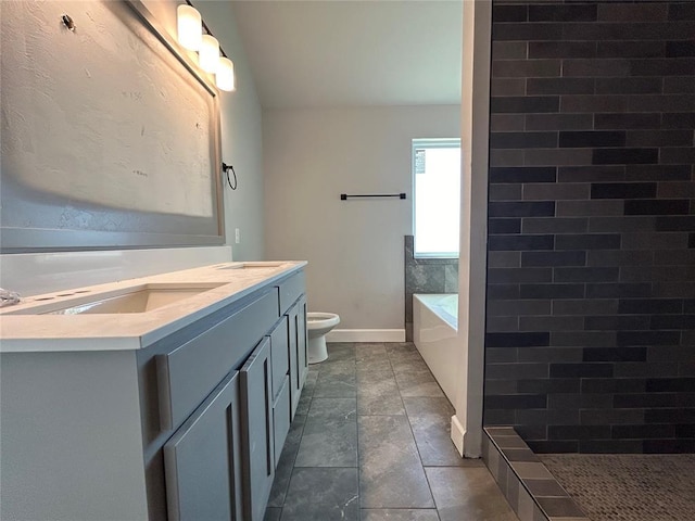 bathroom featuring toilet, baseboards, a bath, and vanity