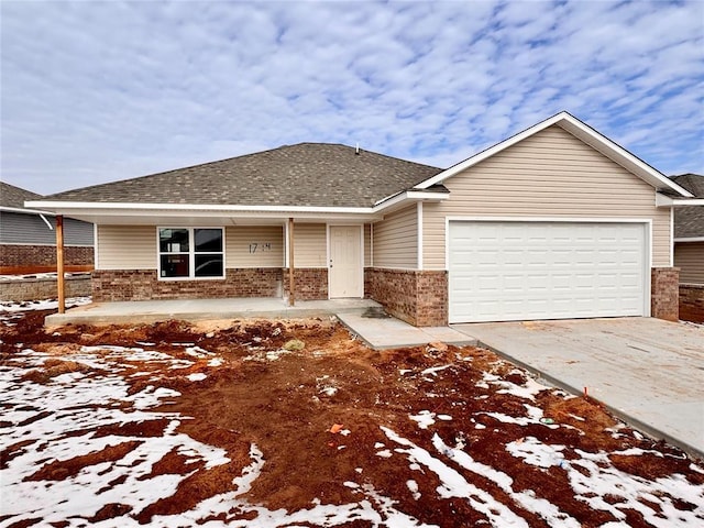 view of front of property featuring a garage and covered porch