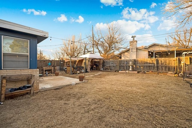 view of yard with a gazebo and a patio