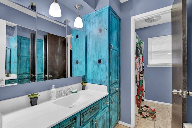 bathroom with tile patterned floors and vanity