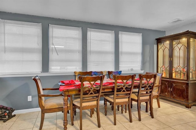 dining area with light tile patterned floors