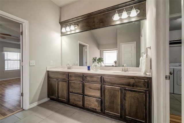 bathroom with tile patterned flooring, vanity, washer and dryer, and ceiling fan