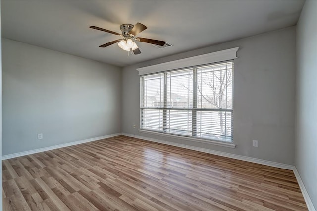 spare room featuring ceiling fan and light hardwood / wood-style floors