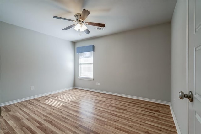 spare room with light hardwood / wood-style flooring and ceiling fan