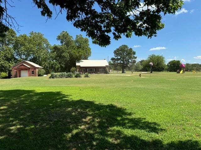 view of yard with a garage