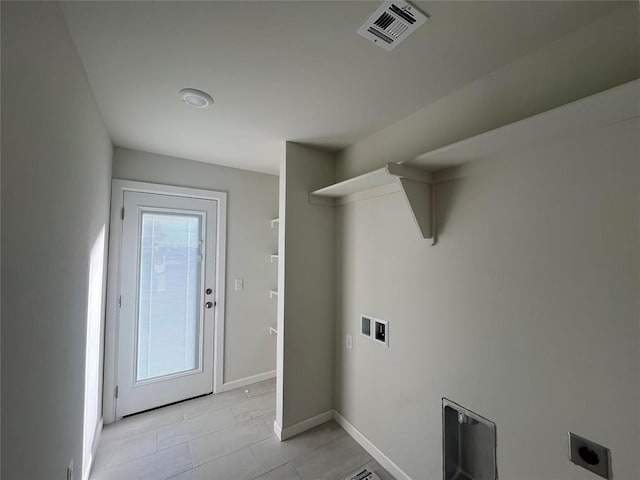 laundry room featuring light tile patterned floors, hookup for an electric dryer, and hookup for a washing machine