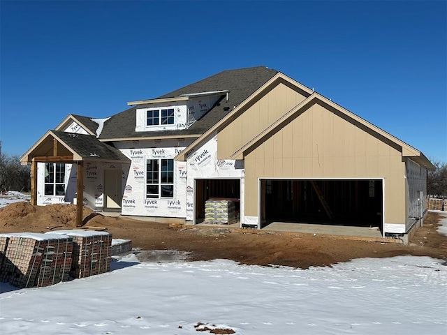 unfinished property with a garage