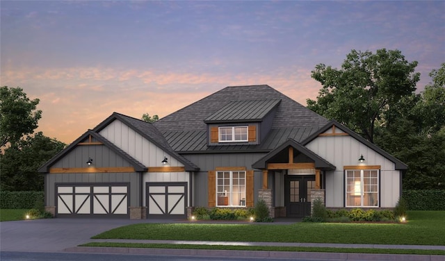 modern inspired farmhouse featuring a garage and a lawn