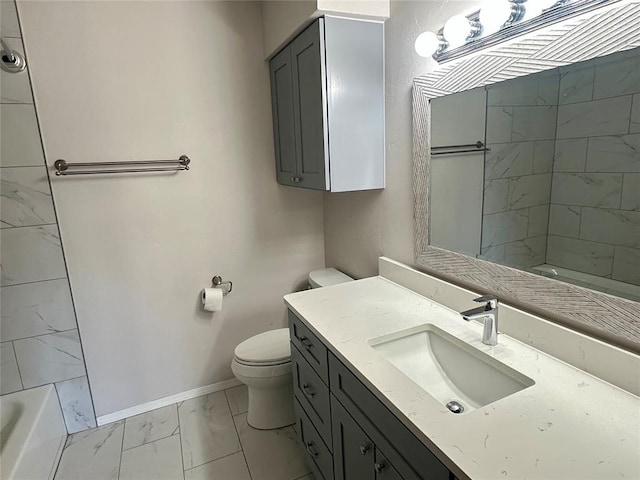 bathroom featuring toilet and vanity