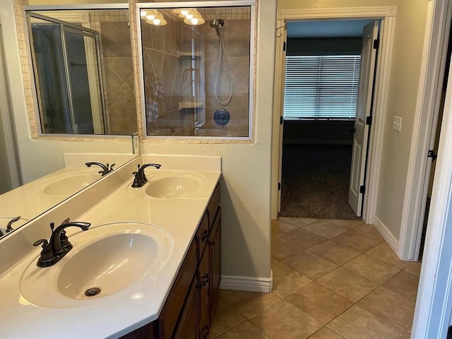 bathroom with vanity, tile patterned floors, and walk in shower