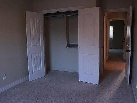 unfurnished bedroom with a closet