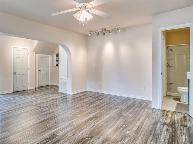 unfurnished room featuring ceiling fan and wood-type flooring