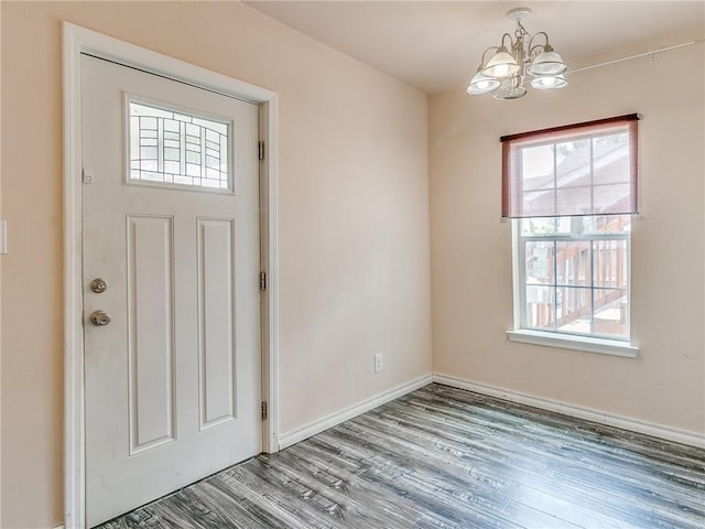 entrance foyer featuring a notable chandelier and hardwood / wood-style floors