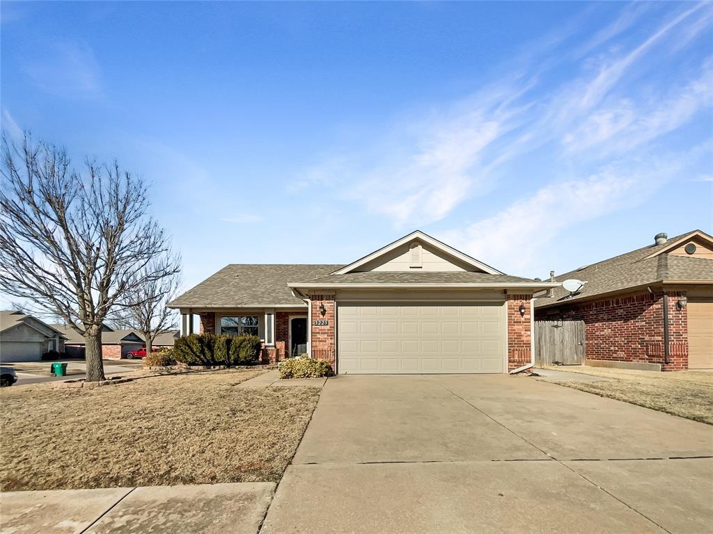 single story home with a garage