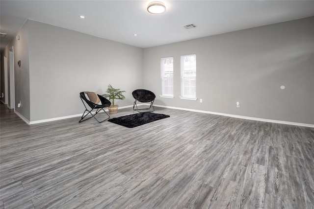 sitting room featuring wood-type flooring