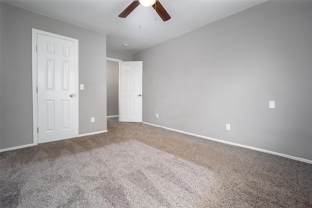 interior space featuring ceiling fan and carpet