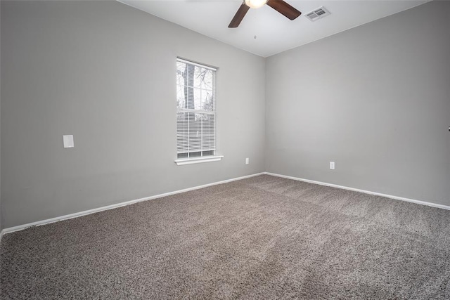 carpeted empty room featuring ceiling fan