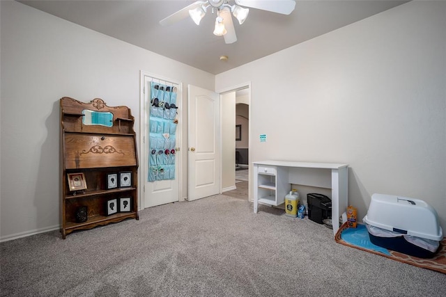 interior space with ceiling fan and carpet