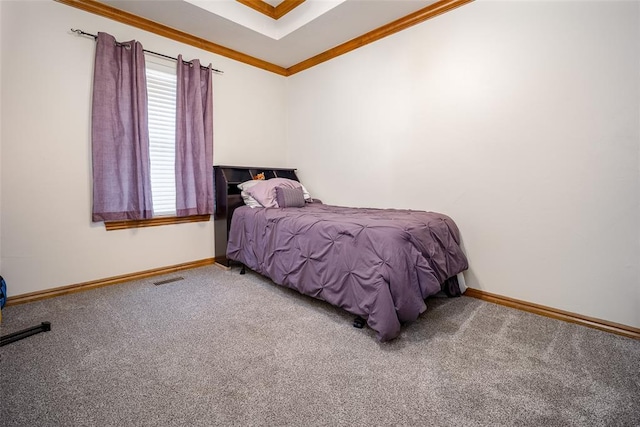 bedroom with ornamental molding, carpet, visible vents, and baseboards