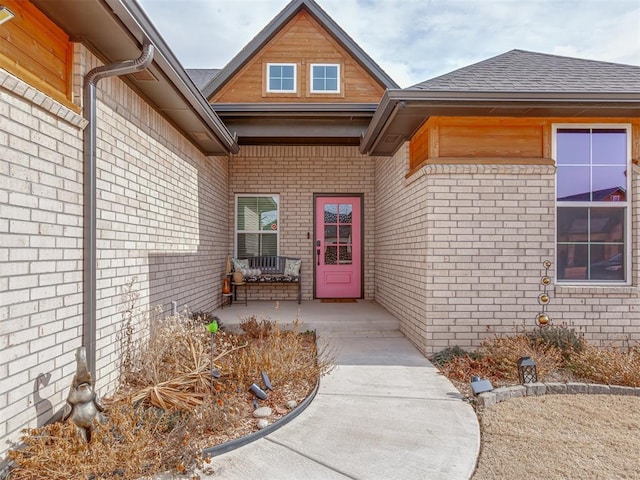 view of exterior entry featuring a patio