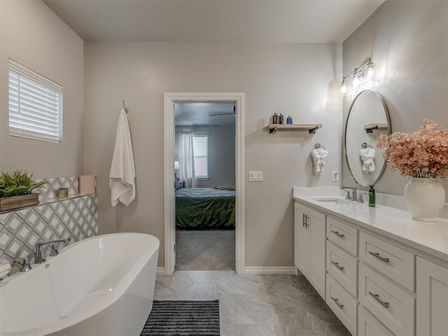 bathroom with vanity and a bathing tub