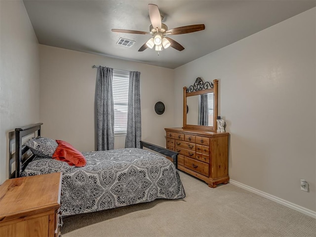 bedroom with light carpet and ceiling fan