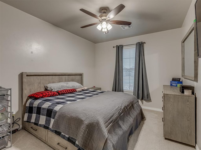 bedroom featuring ceiling fan and light carpet