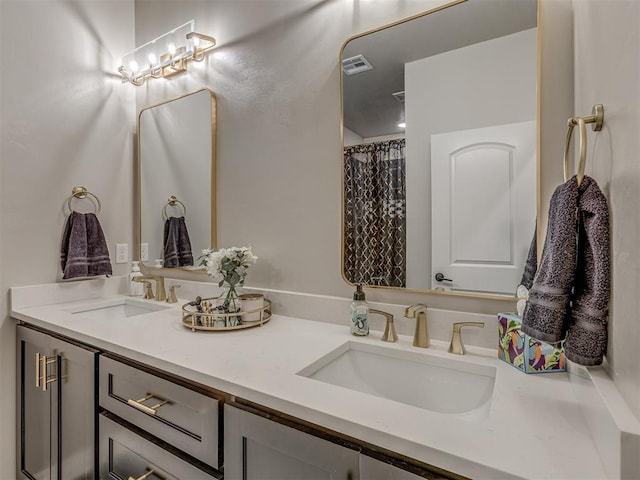 bathroom with walk in shower and vanity