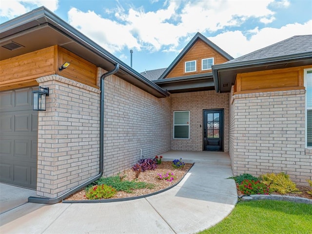 9312 Taggert Ln, Yukon, OK 73099 - entrance to property with brick siding and a garage