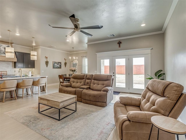9312 Taggert Ln, Yukon, OK 73099 - living area with ceiling fan, recessed lighting, light wood-style flooring, a chandelier, and baseboards