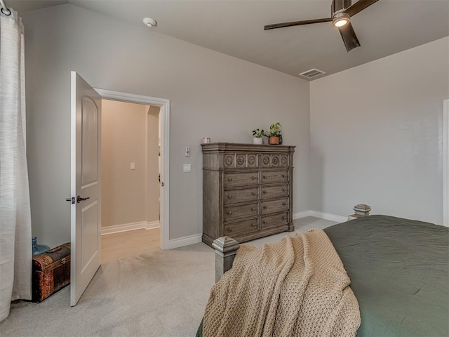9312 Taggert Ln, Yukon, OK 73099 - bedroom with light colored carpet, a ceiling fan, and baseboards