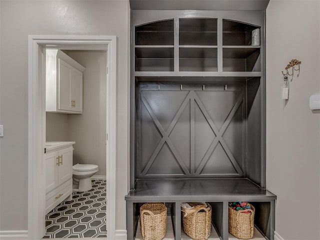 9312 Taggert Ln, Yukon, OK 73099 - mudroom featuring baseboards