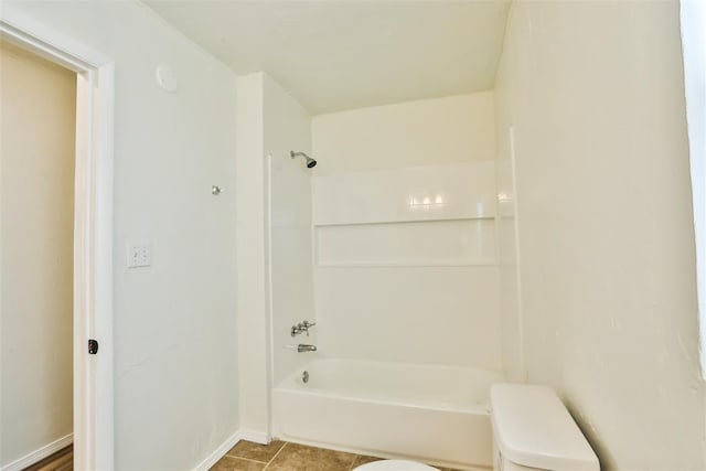 bathroom featuring toilet and shower / washtub combination