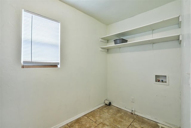 laundry area featuring light tile patterned floors and hookup for a washing machine