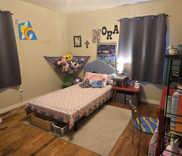 bedroom featuring wood-type flooring