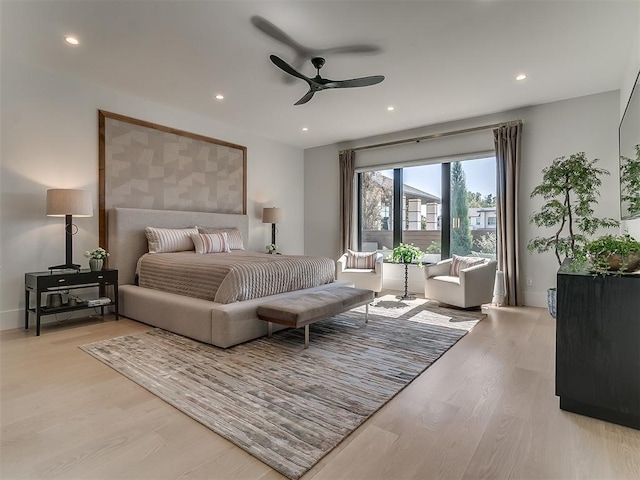 bedroom with light wood-type flooring and ceiling fan