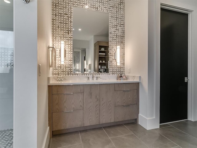 bathroom featuring tile patterned floors, tasteful backsplash, and vanity