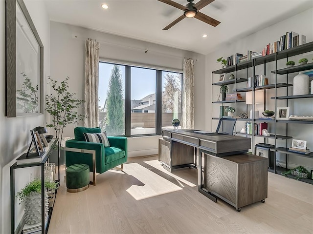 office featuring light wood-type flooring and ceiling fan