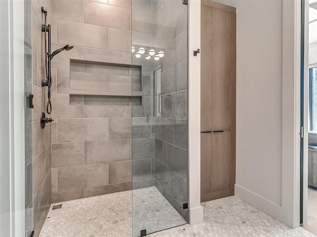 bathroom featuring an enclosed shower