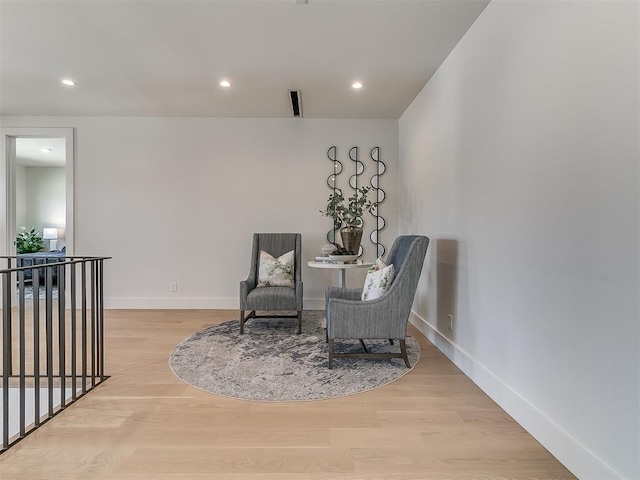 sitting room featuring light hardwood / wood-style floors